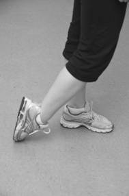 Image depicting toe drag stretch exercise.